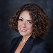 A portrait photo of doctor Dona Halloum, a dentist in Austin, TX