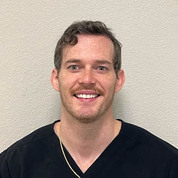 A portrait photo of doctor Joshua Carr, a dentist in Austin, TX