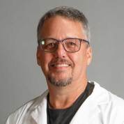 A portrait photo of doctor Kenneth Mueller, a dentist in Austin, TX