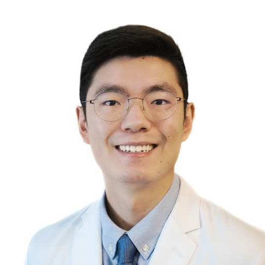 A portrait photo of doctor Sheng Chuan, a dentist in Austin, TX