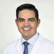 A portrait photo of doctor Manuel Gonzales, a dentist in Austin, TX