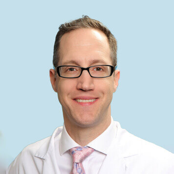 A portrait photo of doctor Brett Strong, a dentist in Austin, TX
